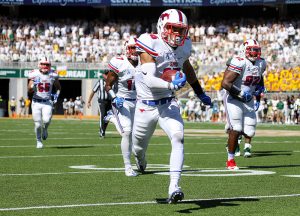 SMU Mustangs defensive back Jordan Wyatt (15) returns an interception down the field against the Baylor Bears at McLane Stadium in Waco, Texas.