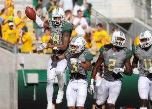 Baylor Bears safety Orion Stewart (28) celebrates a pick six with his teammates during the second half against the SMU Mustangs at McLane Stadium in Waco, Texas.