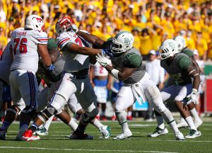 SMU Mustangs offensive lineman Chauncey Briggs (71) is stiff armed by a Baylor Bears defensive lineman during the second half at McLane Stadium in Waco, Texas.