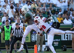 Baylor Bears wide receiver KD Cannon (9) catches a touchdown pass over SMU Mustangs defensive back Christian Davis (28) during the second half at McLane Stadium in Waco, Texas.