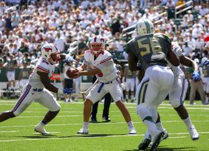 SMU Mustangs quarterback Ben Hicks (8) hands off to SMU Mustangs running back Ke'Mon Freeman (29) during the first quarter against the Baylor Bears at McLane Stadium in Waco, Texas. In his first career start, the redshirt freshman threw for 229 yards on 17 completions, 1 touchdown and 3 interceptions.