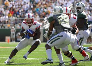 SMU Mustangs running back Ke'Mon Freeman (29) rushes through the line of scrimmage against the Baylor Bears at McLane Stadium in Waco, Texas.