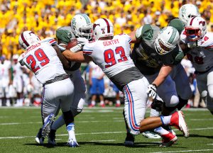 SMU Mustangs defensive back Darrion Millines (29) and defensive end Mason Gentry (93) wrap up a Baylor Bears ball carrier behind the line of scrimmage at McLane Stadium in Waco, Texas. Millines led the team in tackles with 10.